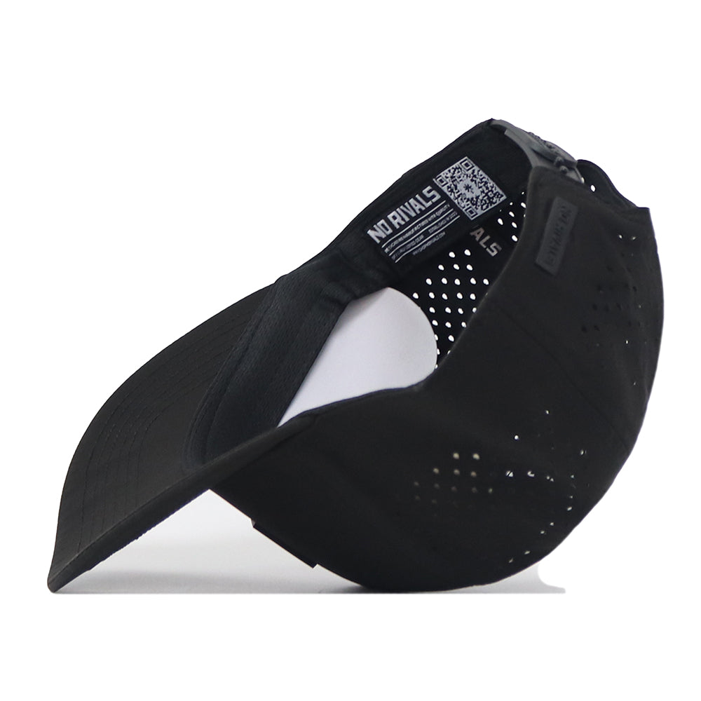 The Arizona State Sun Devils Trainer Hat by No Rivals is displayed from the side and slightly upside down, revealing its perforated back panel, adjustable snapback strap, and an interior label featuring NO RIVALS text and a QR code. Made from high-quality cotton for durability and comfort, this black baseball cap offers a structured fit ideal for everyday wear.