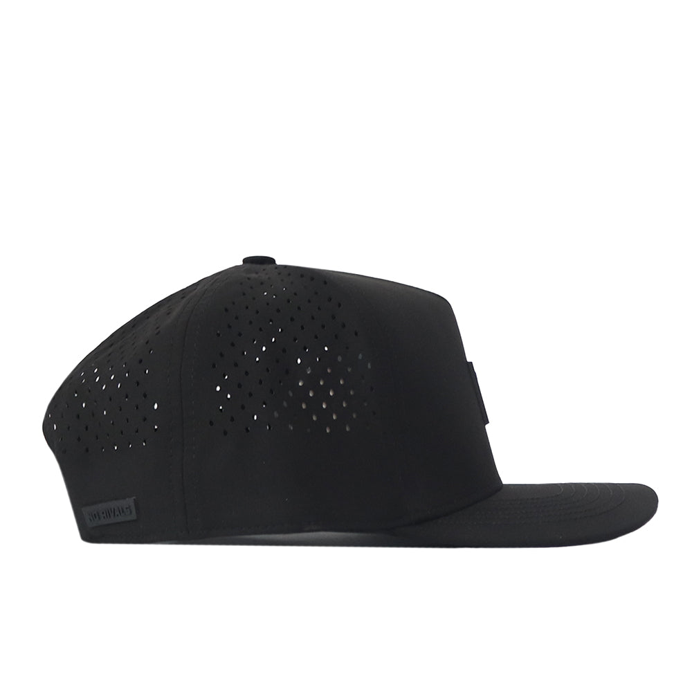 The Kentucky Wildcats Trainer Hat by No Rivals is a black, structured-fit cap shown from the side, featuring small ventilation holes on the back and sides, a flat brim, and crafted from high-quality cotton for lasting comfort.