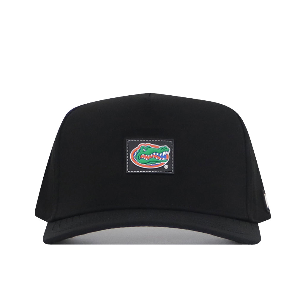 The No Rivals Florida Gators Trainer Hat is a black snapback, crafted from high quality cotton for a structured fit that ensures comfort and durability. It features a patch on the front with the iconic green and orange alligator logo, outlined in white against a black background.