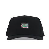 The No Rivals Florida Gators Trainer Hat is a black snapback, crafted from high quality cotton for a structured fit that ensures comfort and durability. It features a patch on the front with the iconic green and orange alligator logo, outlined in white against a black background.