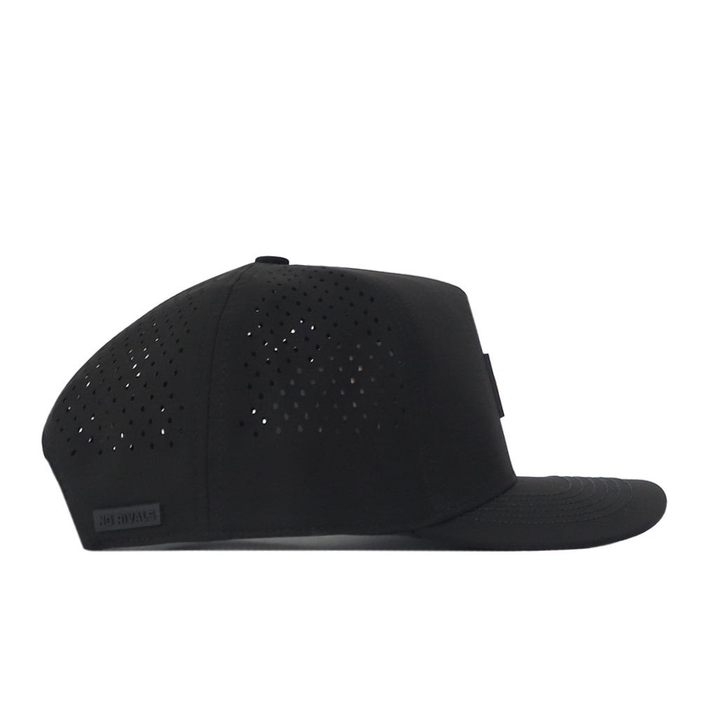 No Rivals North Dakota State Bison Trainer Hat shown in profile view, featuring a black perforated design with a flat brim, ventilation holes on the side and top panels, and an adjustable snapback closure for the perfect gameday fit.
