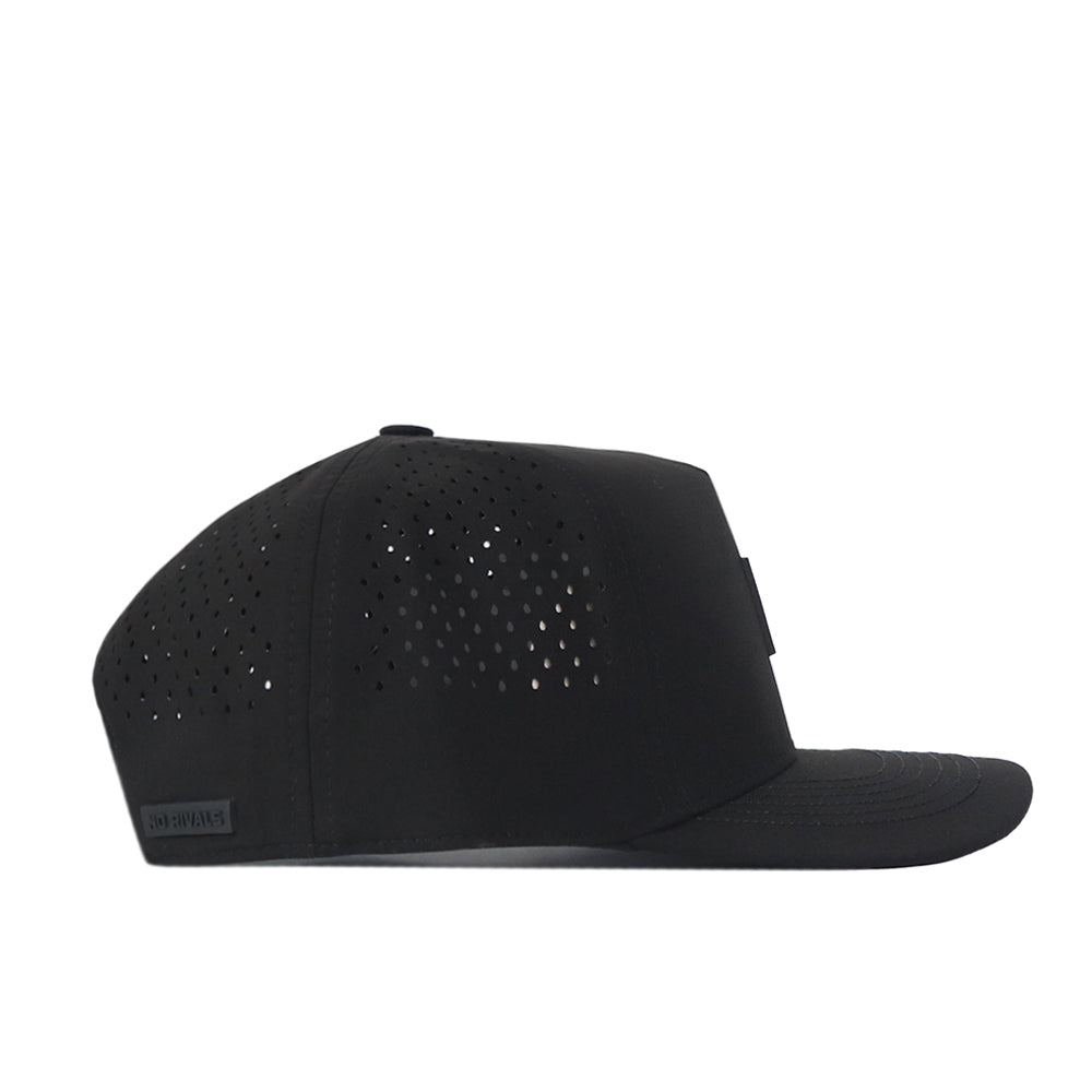A black Nebraska Cornhuskers Trainer Hat by No Rivals with a flat brim, shown in profile. The side panels feature small perforations for ventilation, making it the perfect officially licensed gameday fit.