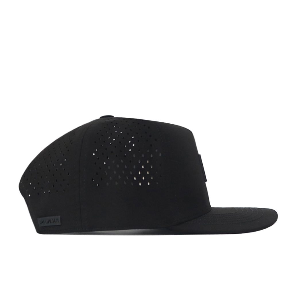 The South Carolina Gamecocks Trainer Hat by No Rivals is a black flat-brim cap displayed from the side, featuring small ventilation holes on the back and side panels. Made from high-quality cotton, this snapback hat provides a comfortable and structured fit for everyday wear.