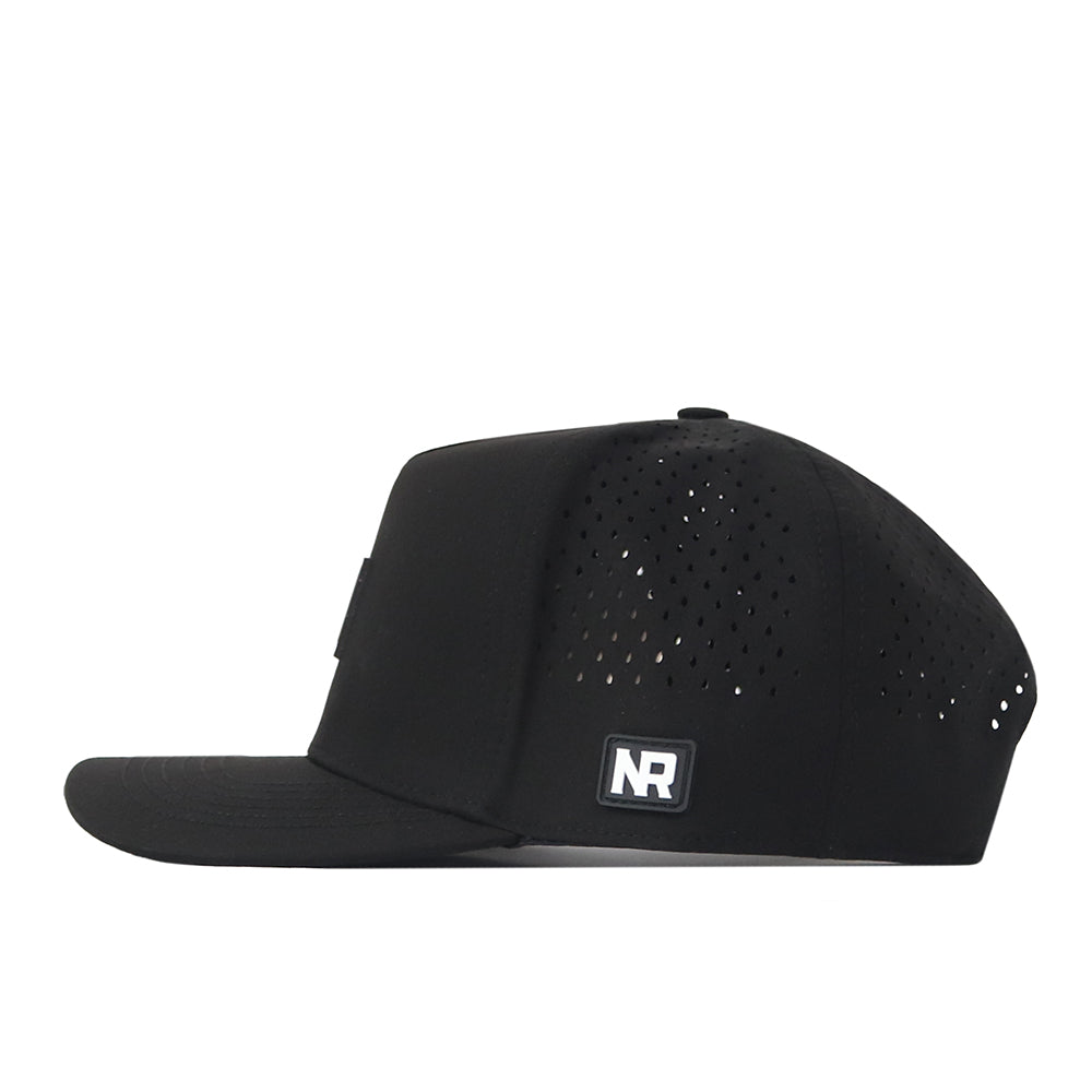 The No Rivals Florida State Seminoles Trainer Hat is a black snapback, expertly crafted from high-quality cotton. It features small ventilation holes on the sides and a square NR logo patch above the brim, presented in a left side profile against a white background for a crisp, structured fit.