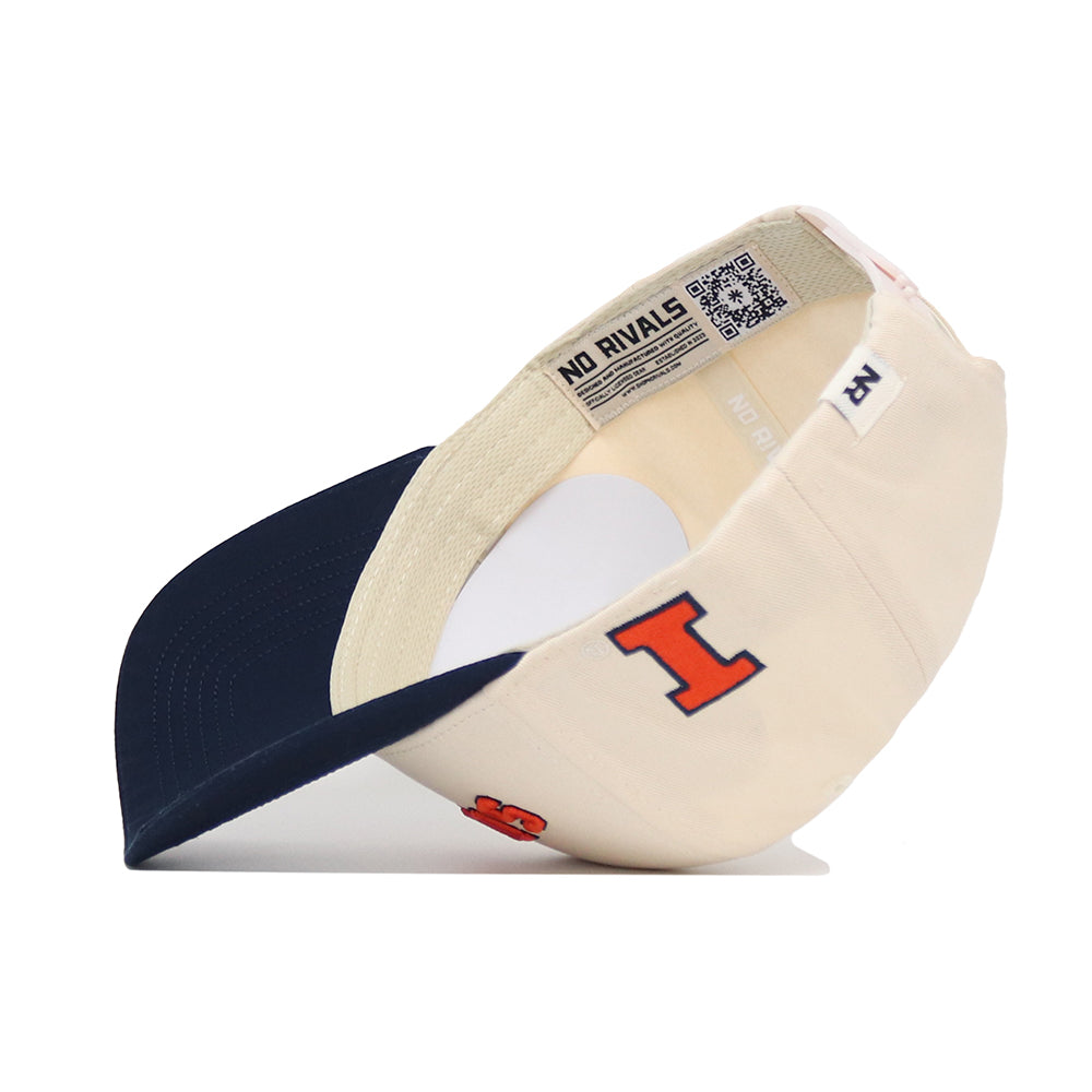 The No Rivals Upside Down Illinois Hat is a cream snapback with a navy brim, featuring a large orange and navy I logo on the side and interior tags; made from high-quality cotton and shown from the side with the brim facing left.