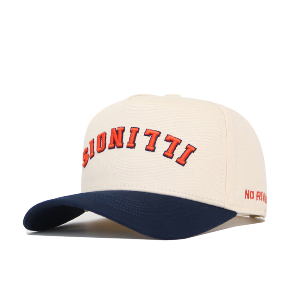 The Upside Down Illinois Hat by No Rivals is a beige snapback made from premium cotton, with bold red "BIONITTI" on the front, "NO RIV" on the side, a dark blue brim, and a structured fit for a modern look.