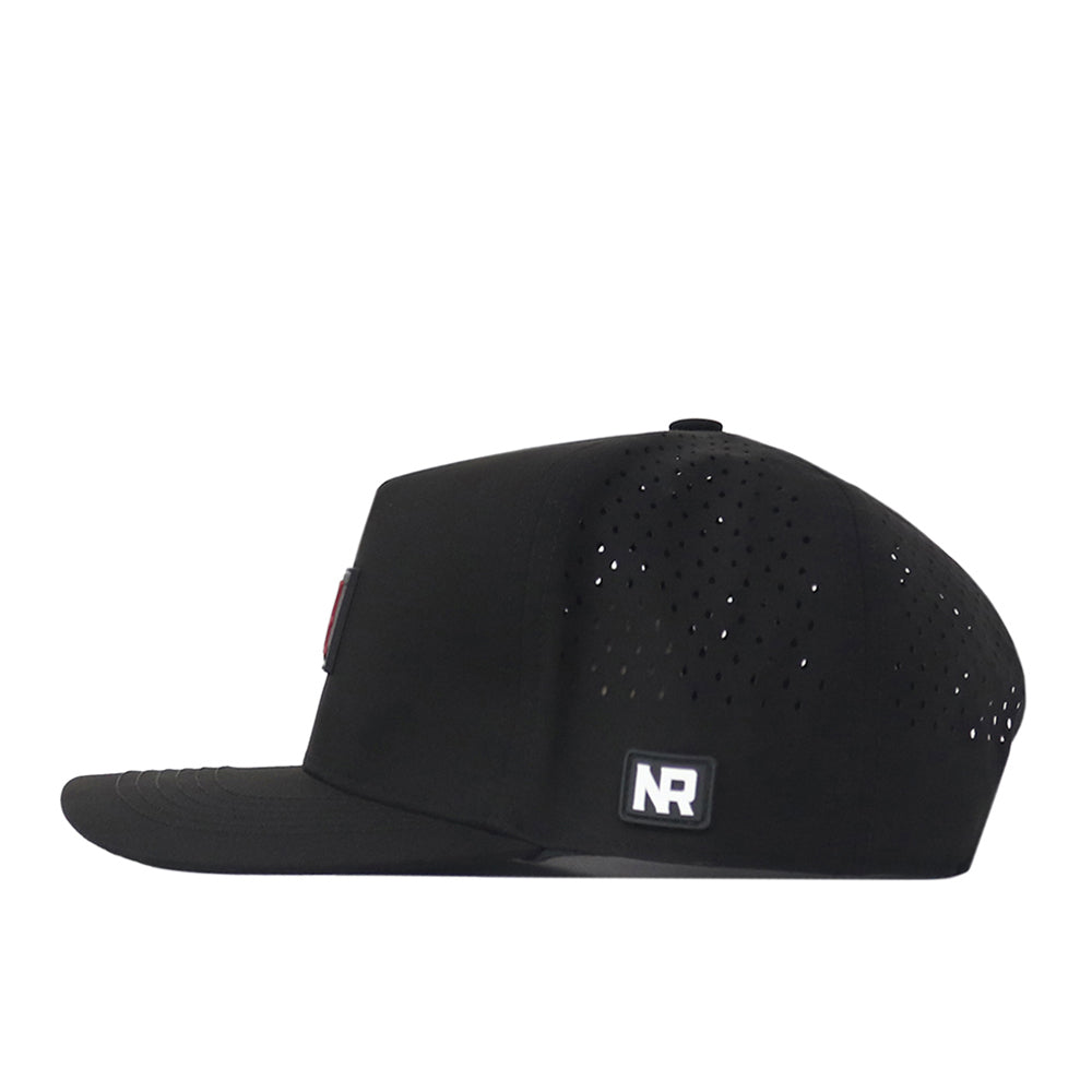 Side view of the Alabama Crimson Tide Trainer Hat by No Rivals, a black flat-bill snapback with a structured fit, small ventilation holes on the back half, and a rectangular NR patch near the back edge. Made from high-quality cotton for lasting comfort and style.