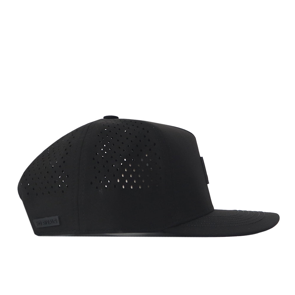 The No Rivals Alabama Crimson Tide Trainer Hat is a black snapback cap made from high-quality cotton, featuring a flat brim and small ventilation holes on the side and back panels. Displayed in a side profile against a white background, this structured hat combines comfort and style for everyday wear.