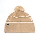 Show your Badger pride with the Wisconsin Badger Desert Beanie from No Rivals. This tan knit beanie features a playful pom-pom on top, two slim horizontal stripes, and a small embroidered logo on the front—ideal for gameday style. A black tag with “NR” accents the folded brim for an extra touch of brand detail.