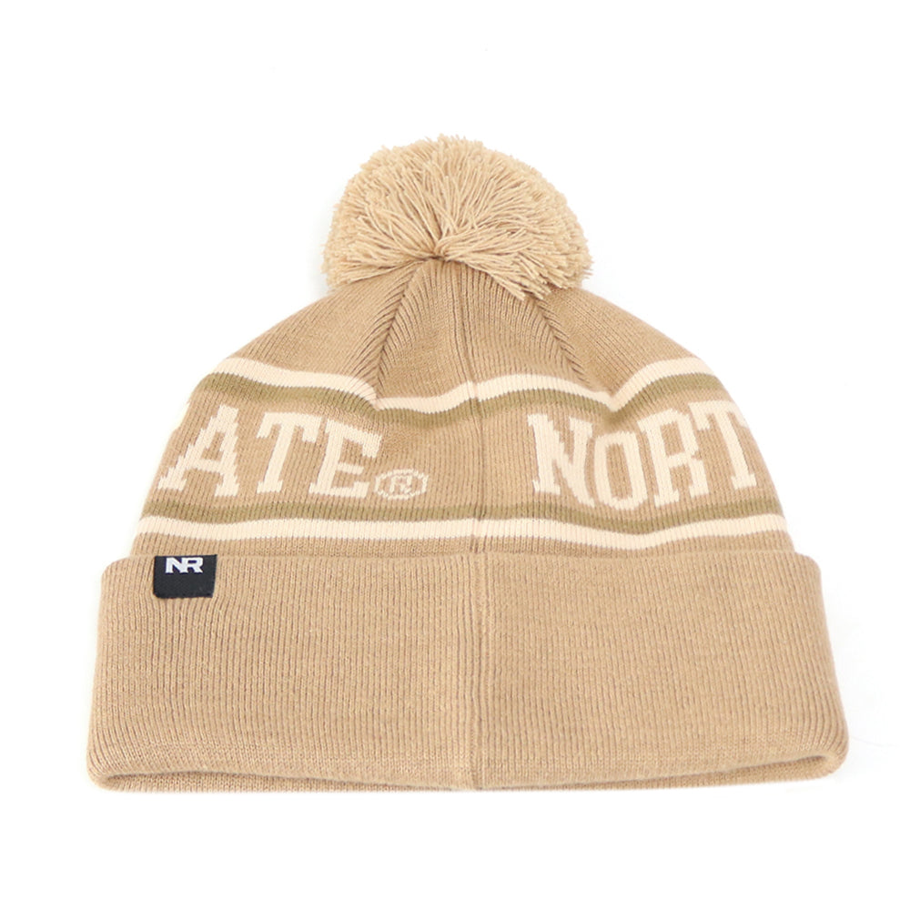 Stay warm and stylish on game day with the North Dakota State Bison Desert Beanie by No Rivals. This tan knit beanie features white stripes, a playful pom-pom on top, STATE and NORTH lettering, a folded brim, and an embroidered logo patch on the front—making it the perfect finishing touch for your gameday outfit.