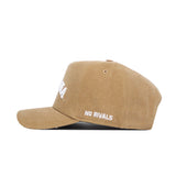 The Montana Rustic Hat by No Rivals is a brown cotton canvas, structured snapback featuring white embroidered "NO RIVALS" text on the side, shown in left profile against a white background—an everyday classic.