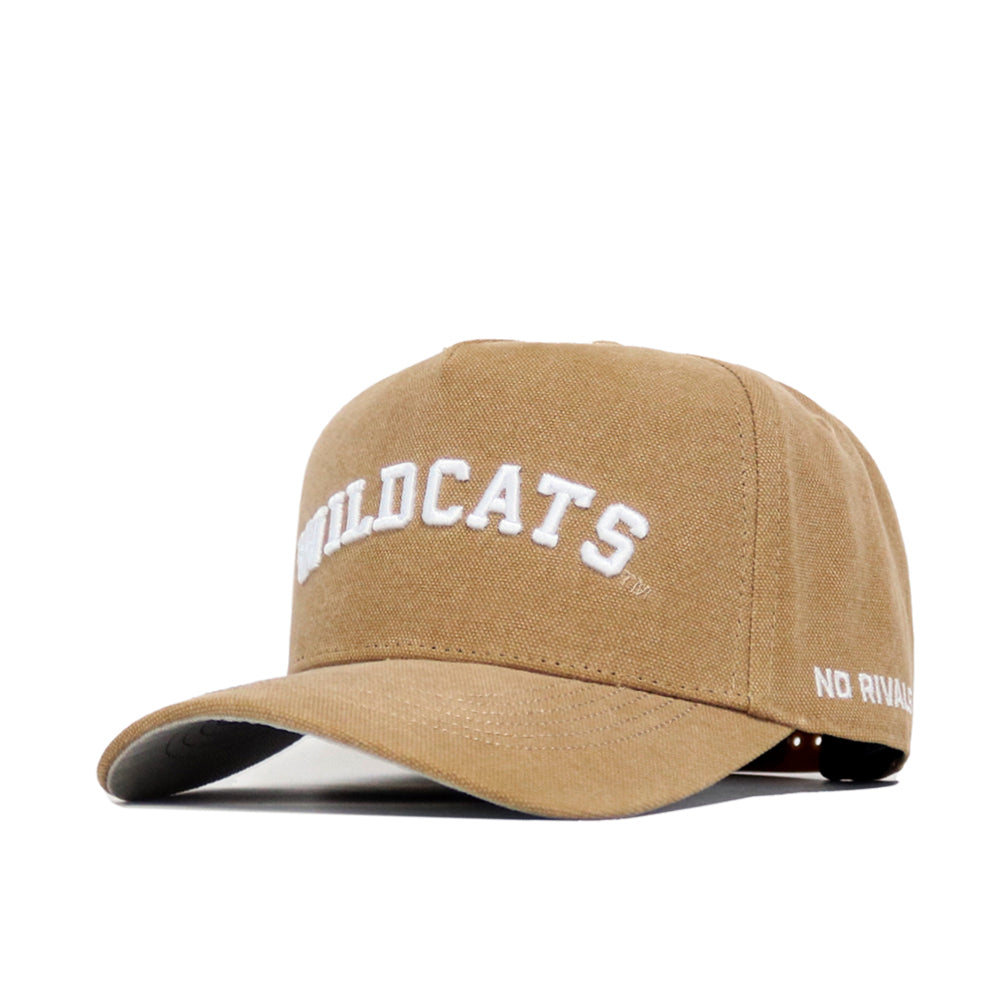 The Kansas State Rustic Hat by No Rivals is a tan cotton canvas baseball cap with "WILDCATS" embroidered in white on the front, "NO RIVALS" on the brim’s side, and an adjustable snap back for a perfect fit.