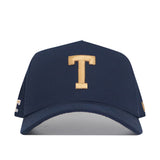 The No Rivals Georgia Tech Block T Hat is a navy snapback cap with a gold embroidered "T" on the front, featuring a curved brim and classic style—perfect for your gameday look.