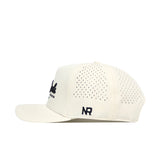 The No Rivals Golf Hat - Tan features a flat brim, black "NR" embroidered logo on the side, snapback adjustment, and perforated holes on the back panels for ventilation.