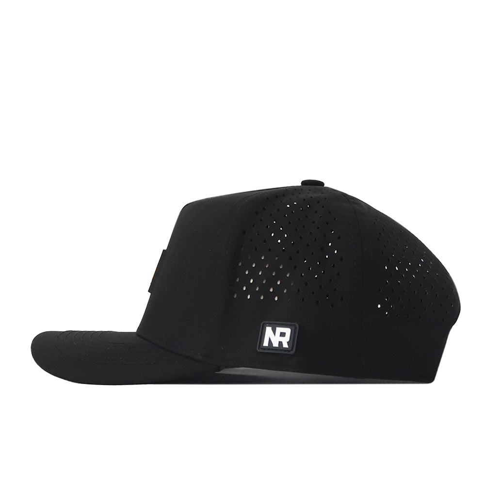 The Iowa Hawkeyes Trainer Hat by No Rivals is shown from the side, featuring small ventilation holes and a rectangular NR logo patch on the side panel. Crafted from high quality cotton, this hat has a flat brim and a structured fit for lasting comfort and style.