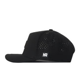 The Iowa Hawkeyes Trainer Hat by No Rivals is shown from the side, featuring small ventilation holes and a rectangular NR logo patch on the side panel. Crafted from high quality cotton, this hat has a flat brim and a structured fit for lasting comfort and style.