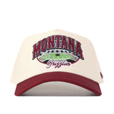 The No Rivals Montana Grizzlies Stadium Hat is a cream and maroon snapback baseball cap featuring “Montana Grizzlies” text and an embroidered football field on the front, along with officially licensed embroidered logos.