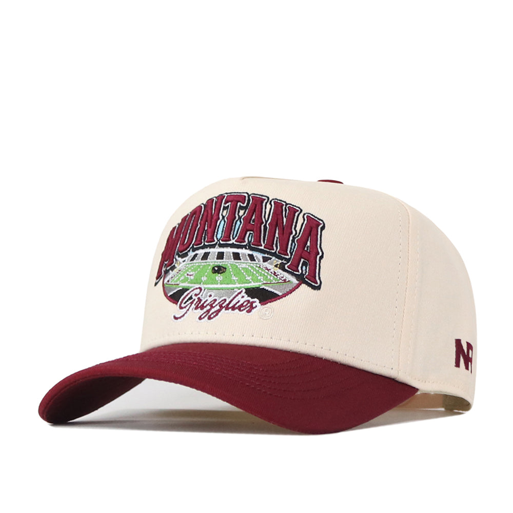 The No Rivals Montana Grizzlies Stadium Hat is a beige and maroon snapback baseball cap with an embroidered football field graphic and officially licensed Montana Grizzlies logos on the front.