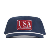 The No Rivals USA Land of the Free Patch Hat is a navy structured cotton cap with a red and white “USA 250th LAND OF THE FREE” patch, white bill trim, and adjustable snapback closure for the perfect fit.