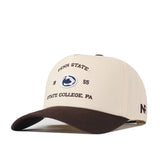 The Penn State Outlaw Hat - Classic by No Rivals is a beige and brown baseball cap featuring “Penn State,” the iconic Nittany Lion logo, “1895,” and “State College, PA” embroidered on the front. The letters “NF” are stitched on the side, and it includes detailed embroidery with a snap back adjustment for a perfect gameday fit.