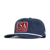 The No Rivals USA Land of the Free Patch Hat is a navy cotton snapback with a red and white "USA 250th LAND OF THE FREE" patch, white brim trim, and side lettering for a structured fit.
