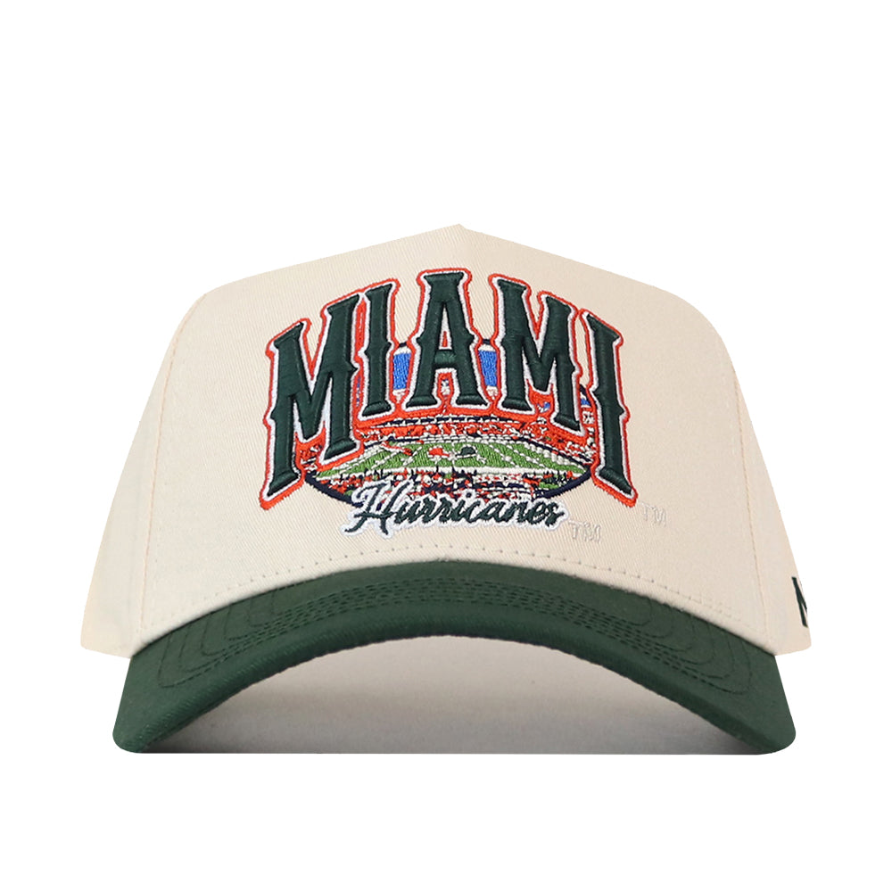 Cream-colored No Rivals Miami Stadium Hat with a dark green brim, featuring an officially licensed embroidered graphic of a stadium and the text MIAMI Hurricanes on the front.