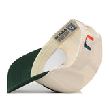 Off-white No Rivals Miami Stadium Hat with a dark green brim and a stylized orange and green U logo embroidered on the side.