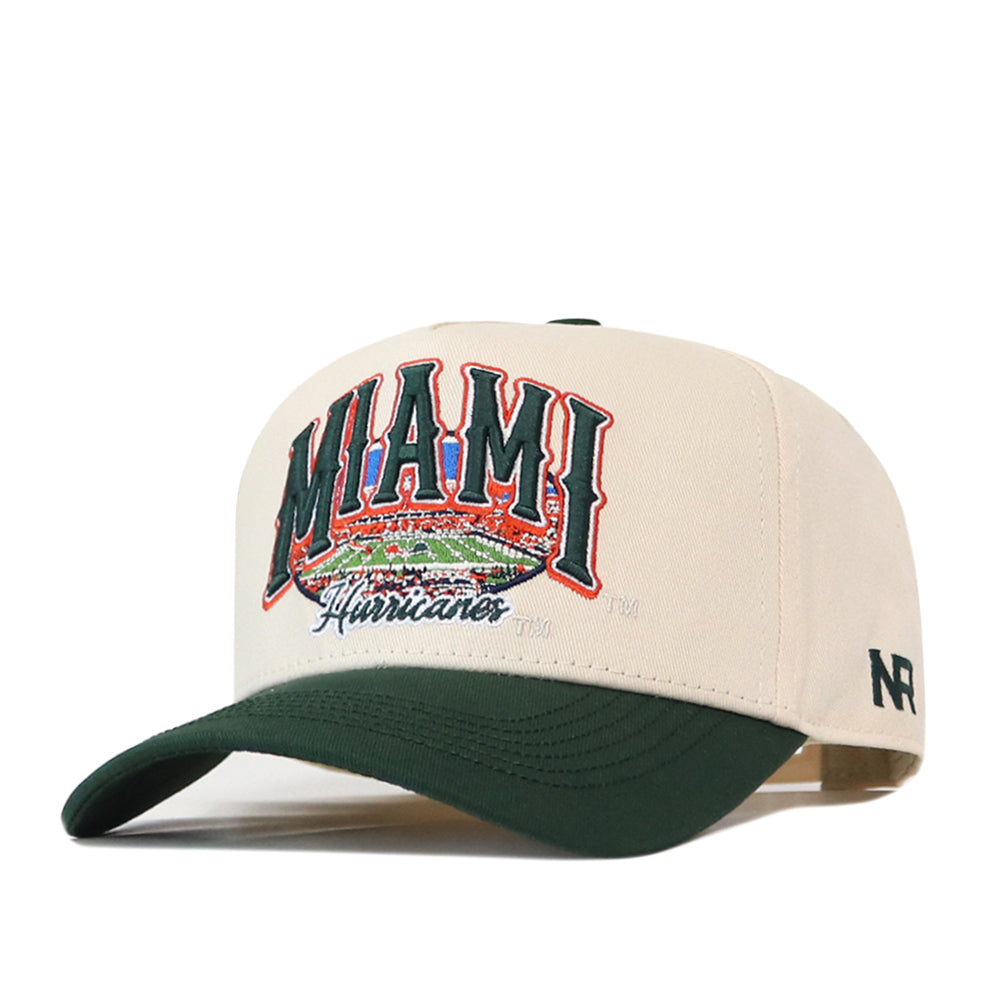No Rivals Miami Stadium Hat in cream with a dark green brim and an embroidered graphic on the front showing a stadium with the text MIAMI Hurricanes.
