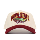 Introducing the Iowa State Stadium Hat by No Rivals: a premium cotton cream and red snapback cap, showcasing bold embroidered football field graphics and Iowa State Cyclones details on the front.