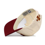 The Iowa State Stadium Hat by No Rivals is a cream and red snapback shown upside down to display the inside label featuring the NO RIVALS text, a QR code, and premium cotton construction; embroidered I State logo graphics appear on the exterior.