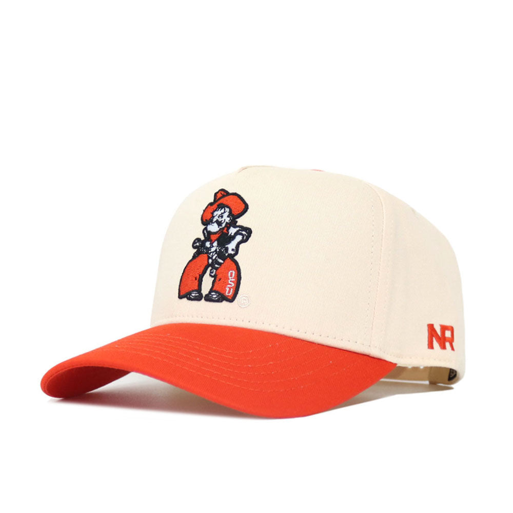 The OSU Full Pistol Pete Patch Hat by No Rivals is a beige snapback with a red brim, cartoon cowboy logo patch on the front, and red NR initials embroidered on the side. Made from high-quality cotton for structured, lasting comfort.