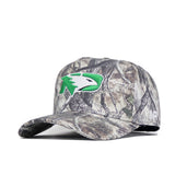 The North Dakota Outland Hat by No Rivals is a structured, high-quality cotton baseball cap with a camouflage pattern and a green and white bird head logo on the front, shown against a plain white background.