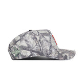 The Illinois Outland Hat by No Rivals is a gray camouflage snapback with a structured fit and flat brim, featuring a tree branch and leaf pattern. Made of high-quality cotton, the cap is shown from a side profile view.