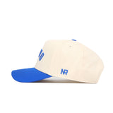 The No Rivals Provo Hometown Hat is a structured-fit beige cap with a royal blue brim and blue embroidered NR on the side. Made from durable cotton, this snapback offers lasting comfort and classic style.