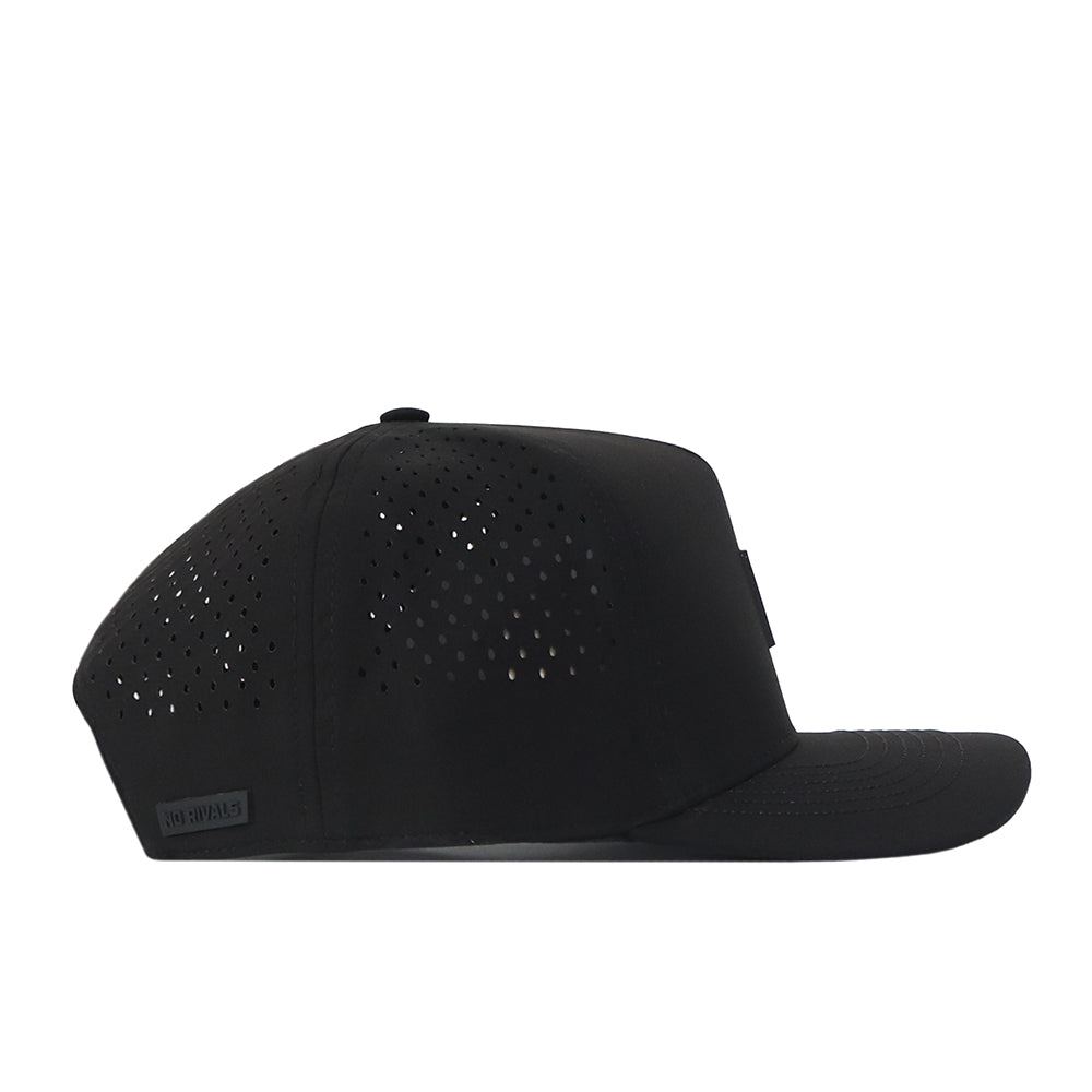 A black Miami Hurricanes Trainer Hat by No Rivals with a flat brim, shown from the side. Crafted from high quality cotton for durability, this cap features small ventilation holes on the side panels and a subtle logo tag near the back, offering both a structured fit and timeless style.