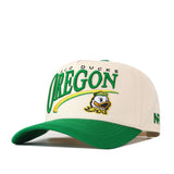 Introducing the Oregon Ducks Stride Hat by No Rivals—a white and green snapback featuring “Oregon,” the Oregon Ducks name, and a cartoon duck logo on the front. The structured fit hat offers a green brim, embroidered NR logo on the side, and is crafted from high quality cotton for lasting comfort.