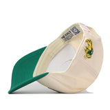 The No Rivals North Dakota State Bison Stadium Hat is pictured upside down, revealing an inside tag and an embroidered green and yellow Bison mascot on the side. This officially licensed snapback cap features detailed embroidered logos for an authentic look.