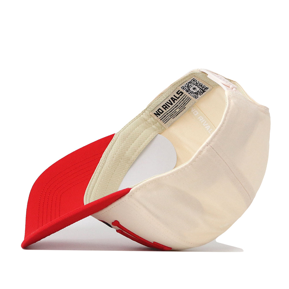 The Texas Tech Red Raiders Stride Hat by No Rivals is displayed upside down, highlighting its inner tag that reads “NO RIVALS” and features a QR code. The hat has a red brim and an off-white crown. This snapback combines classic style with modern details, making it perfect for any casual outfit.