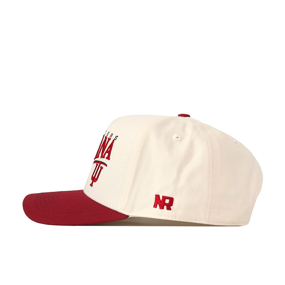 Introducing the Indiana Hoosiers Stride Hat by No Rivals—a cream-colored snapback cap with a vibrant red brim, matching red top button, and bold red embroidered text and logo on the side. Made from premium cotton for a structured fit, this hat features “NR” in striking red on the side panel and is presented from a side angle.