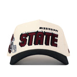 The No Rivals Mississippi State Alma Mater Hat is an officially licensed cream and black snapback featuring “MISSISSIPPI STATE” in bold maroon letters on the front, along with detailed embroidered logos—including a partial image of a helmeted bulldog—on the left side.