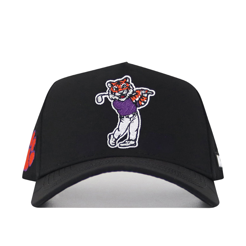Introducing the No Rivals Clemson Golf Hat - Swinging - Black: this adjustable snapback hat features a striking embroidered cartoon tiger swinging a golf club in a purple shirt, complemented by an eye-catching logo and a vibrant orange paw print on the side—perfect for showing your gameday spirit.