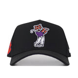 Introducing the No Rivals Clemson Golf Hat - Swinging - Black: this adjustable snapback hat features a striking embroidered cartoon tiger swinging a golf club in a purple shirt, complemented by an eye-catching logo and a vibrant orange paw print on the side—perfect for showing your gameday spirit.