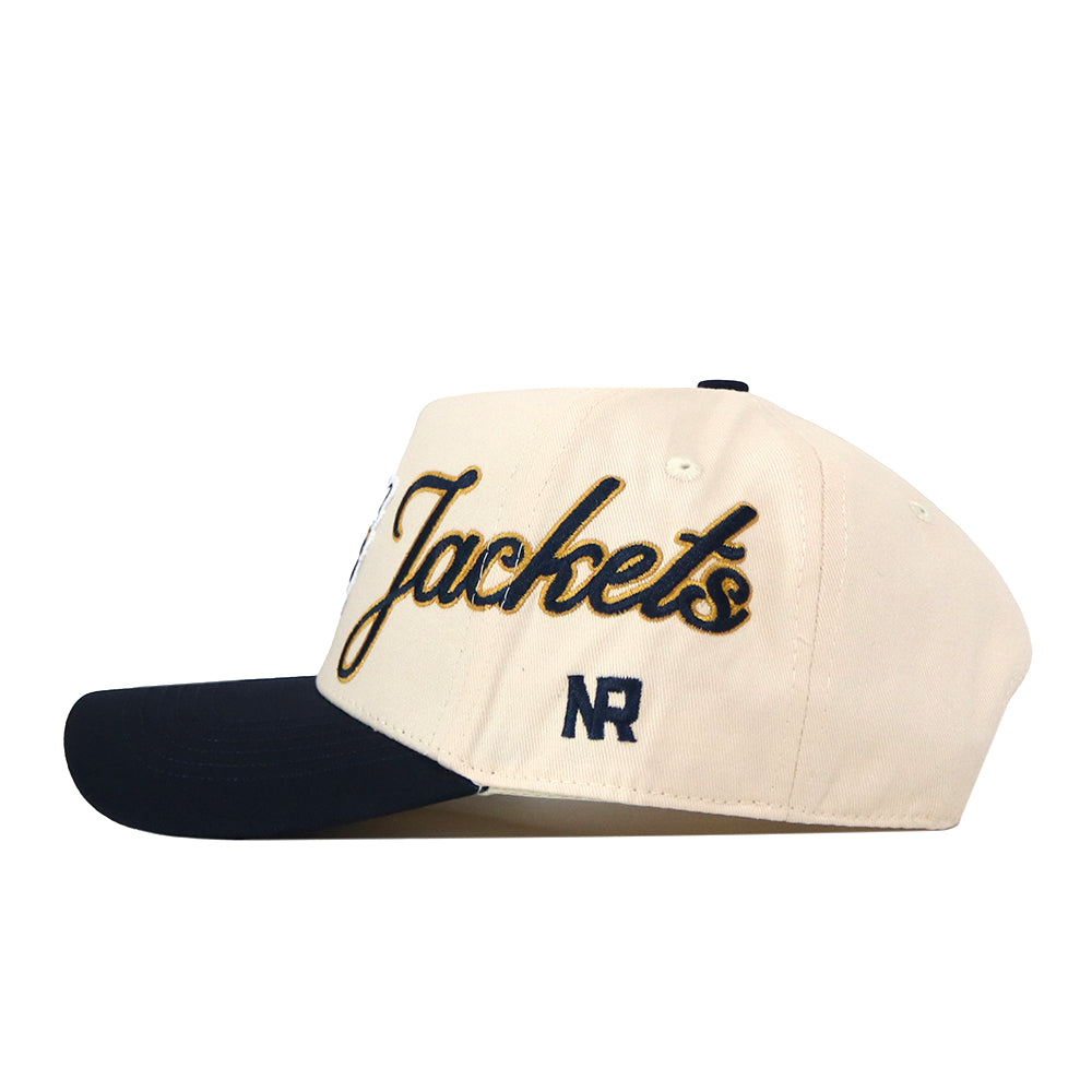 Introducing the Georgia Tech Yellow Jackets Halftime Hat by No Rivals—a beige snap back baseball cap featuring a navy blue brim. The side showcases an embroidered “Jackets” logo in gold and black, with the NR initials stitched below. This officially licensed hat blends authentic style and team spirit, making it perfect for any fan.