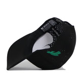 A black North Texas Mean Green Football Mascot Hat by No Rivals is shown turned inside out, revealing the inner label that reads “NO RIVALS.” Made from performance fabric, this cap includes small ventilation holes and displays a green embroidered logo on the exterior.