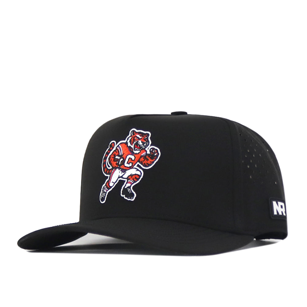 The Clemson Tigers Football Mascot Hat - Black by No Rivals features a cartoon tiger in a football uniform stitched on the front panel and an embroidered NR logo tag on the side. Made from performance fabric, this cap includes a flat brim, small ventilation holes, and a snap back adjustment for a comfortable fit.
