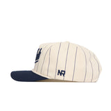 The Georgia Tech Vintage "Jackets" Pinstripe Hat by No Rivals features cream with navy pinstripes, a navy brim, NR side embroidery, and an adjustable snapback. Made from high-quality cotton for comfort and durability.