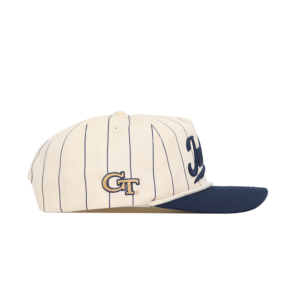 The No Rivals Georgia Tech Vintage "Jackets" Pinstripe Hat features a cream base with navy pinstripes, a navy brim, gold and navy GT logo on the side, high-quality cotton construction, and an adjustable snap back.
