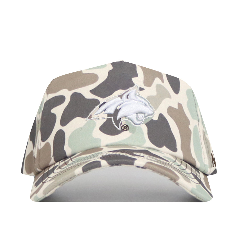 The No Rivals Montana State Huntsman Hat is a 5-panel snapback baseball cap in duck camo with an embroidered white dolphin logo on the front, displayed against a white background.