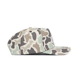The No Rivals NDSU Huntsman Hat is a stylish 5-panel duck camo snapback cap in green, gray, and beige. Shown from the side on a white background, this cap offers comfort and a classic outdoor-inspired design.