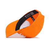 The Tennessee Baseball Script Hat by No Rivals is shown upside down, displaying its black inner band and a QR code label. This cotton blend snapback has a flat brim and a white embroidered logo on the front.